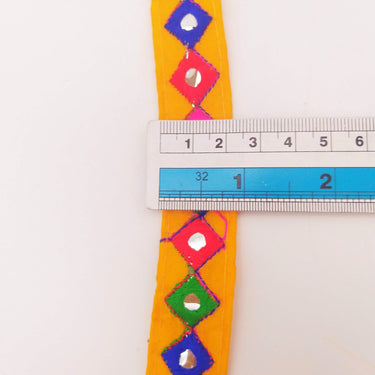 Wholesale Yellow Cotton Fabric Mirrored Trim With Embroidery In Fuchsia Pink, Blue, Red & Green Threads